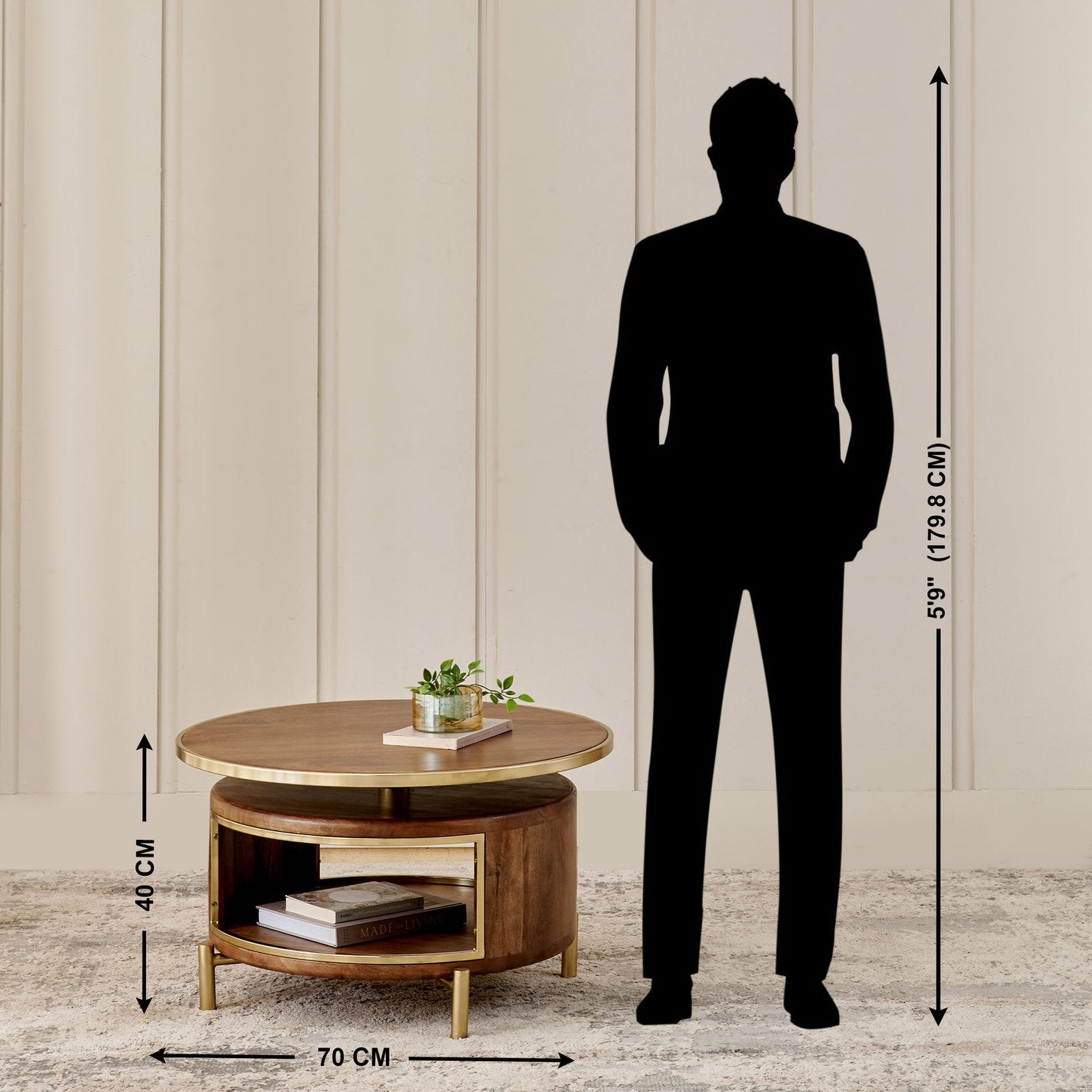 Wooden round coffee table with dimensions shown next to a silhouette of a person.