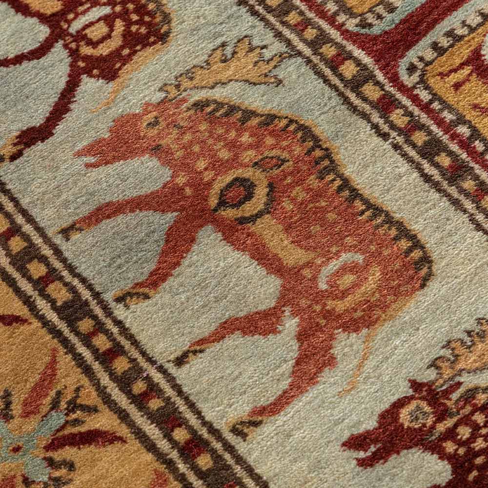 Close-up of a patterned rug with a deer design
