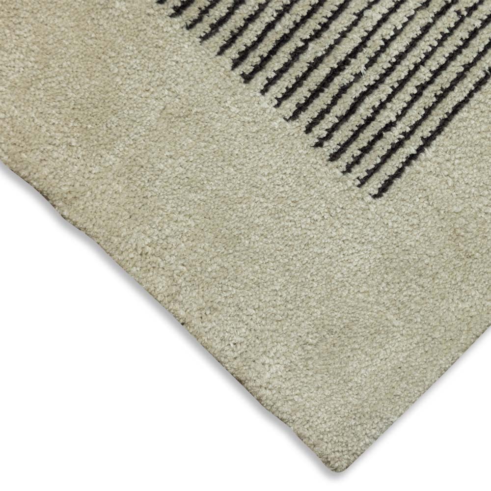Close-up of a textured rug with a geometric pattern on a white background