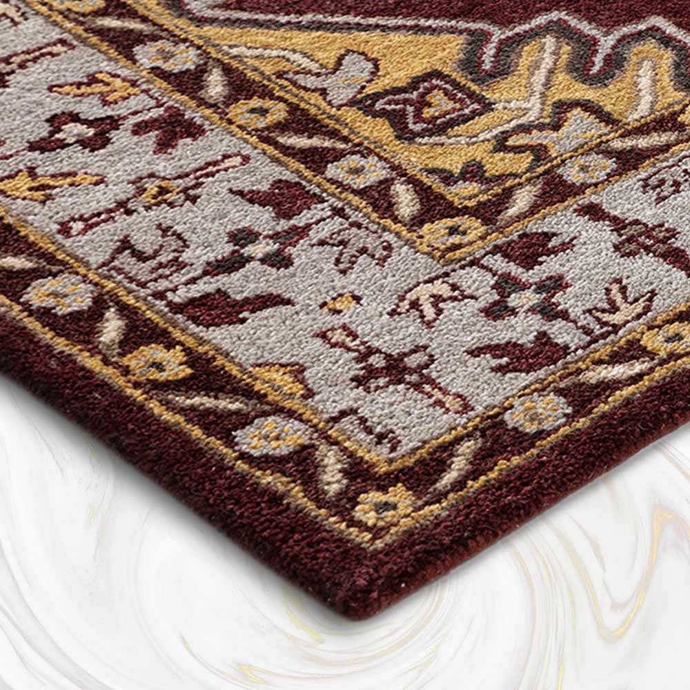 Close-up of a patterned rug with brown, beige, and red colors on a white background.