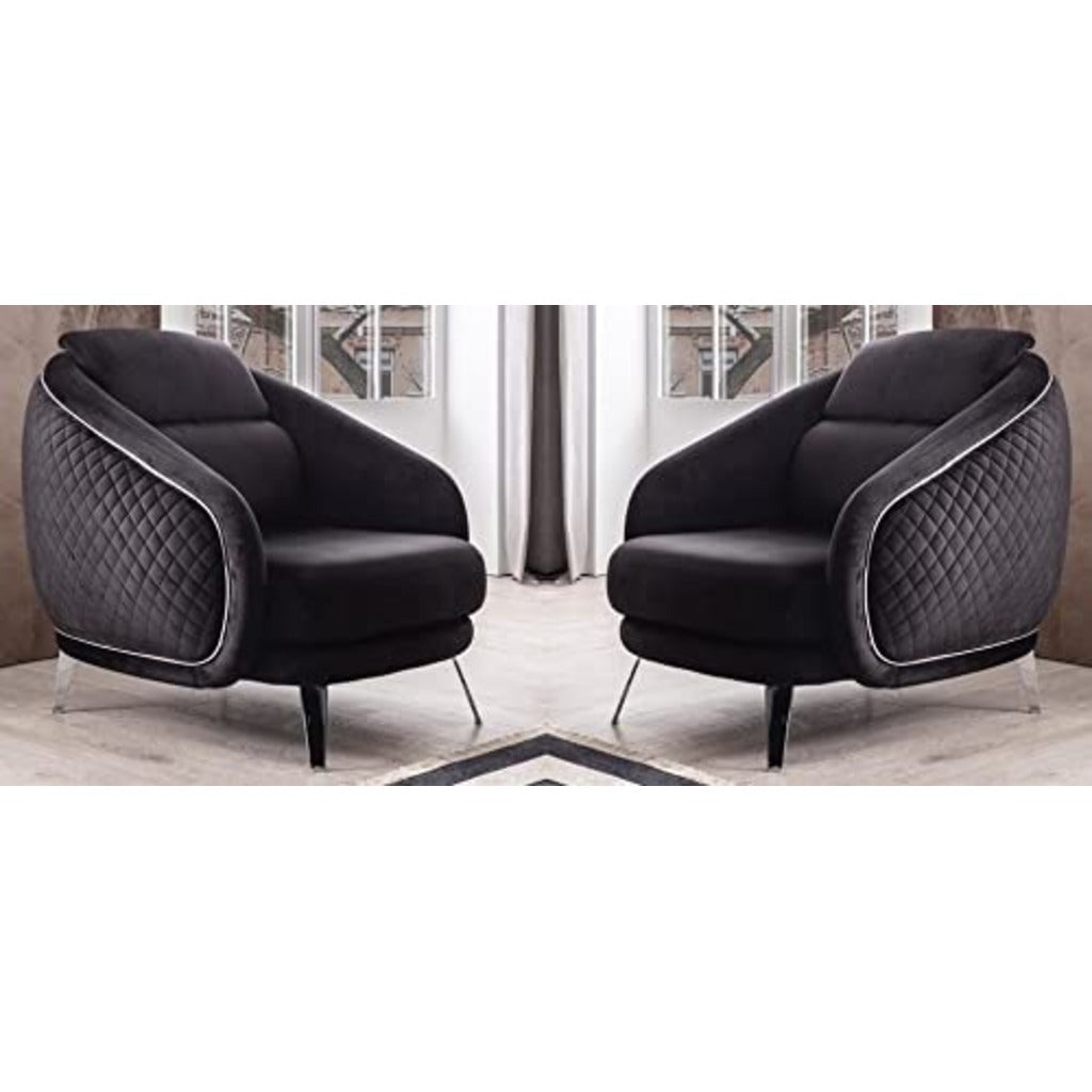 Two black armchairs with quilted design in a room setting.