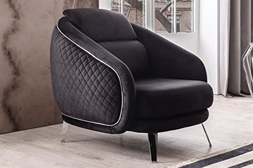 Black armchair with quilted details in a room setting