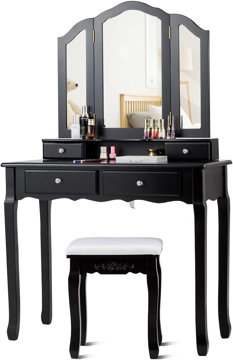 Black vanity table with three mirrors, drawers, and a stool on a white background
