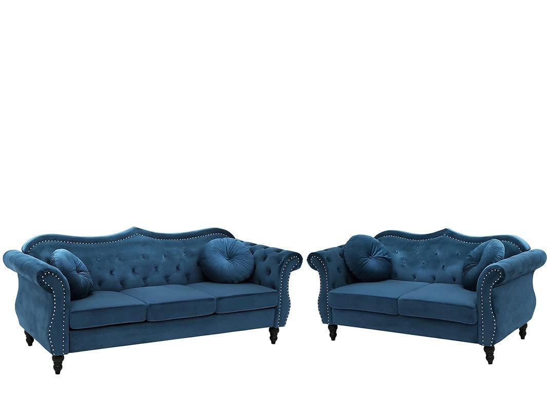 Two blue sofas with tufted backrests on a white background