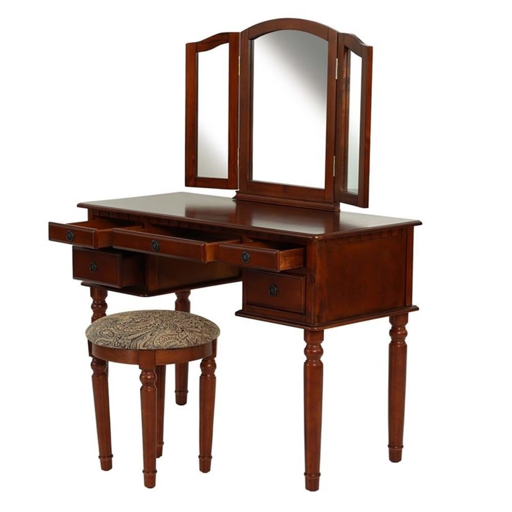 Wooden vanity table with mirror and stool on a white background