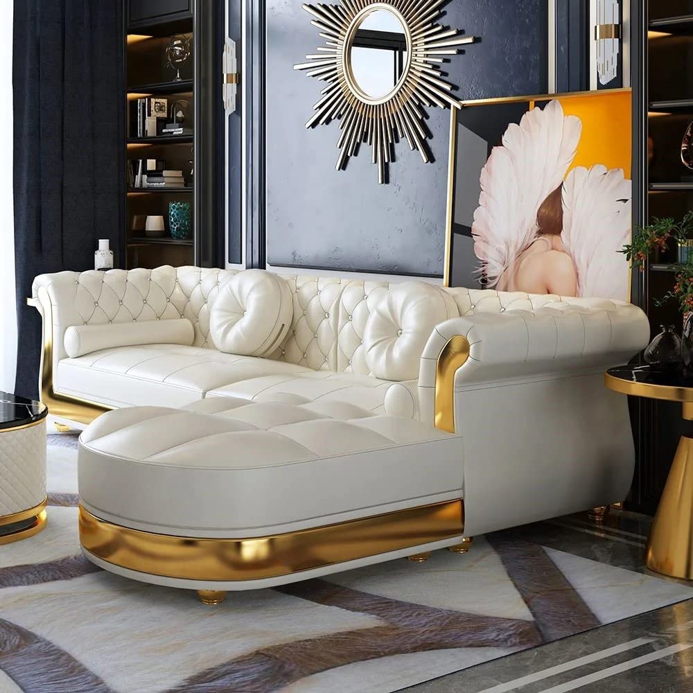 Luxury living room with a white sofa and gold accents