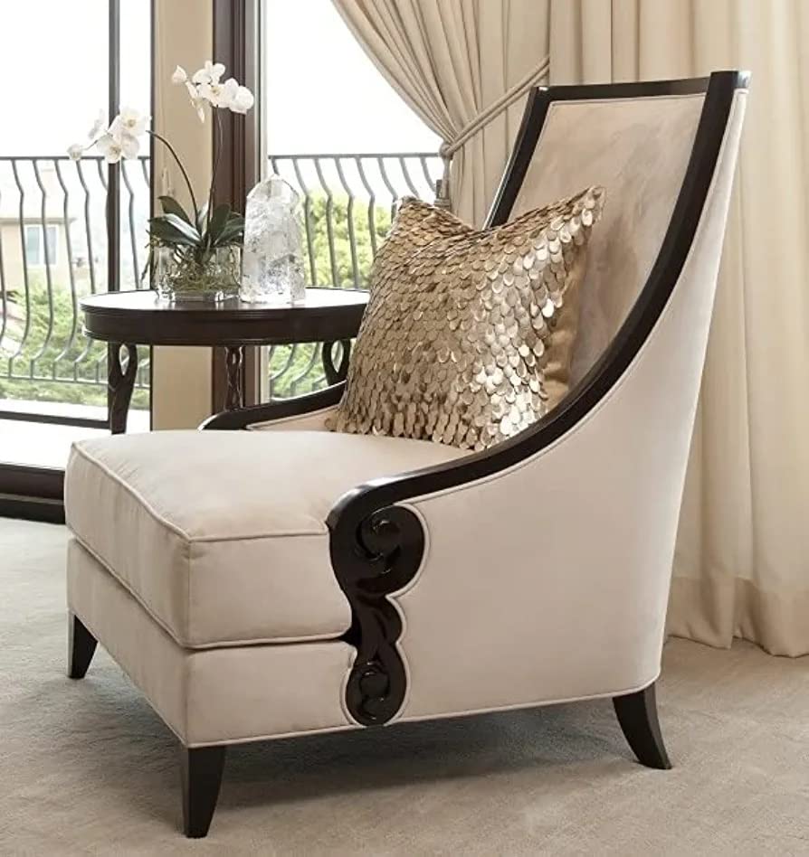 Beige armchair with decorative pillow in a room with large windows and curtains.