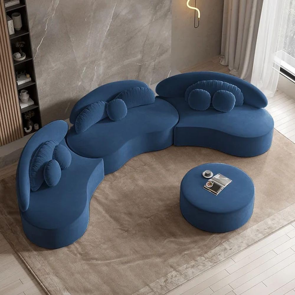 Blue modern sofa set with a round ottoman in a room with marble walls and a window.