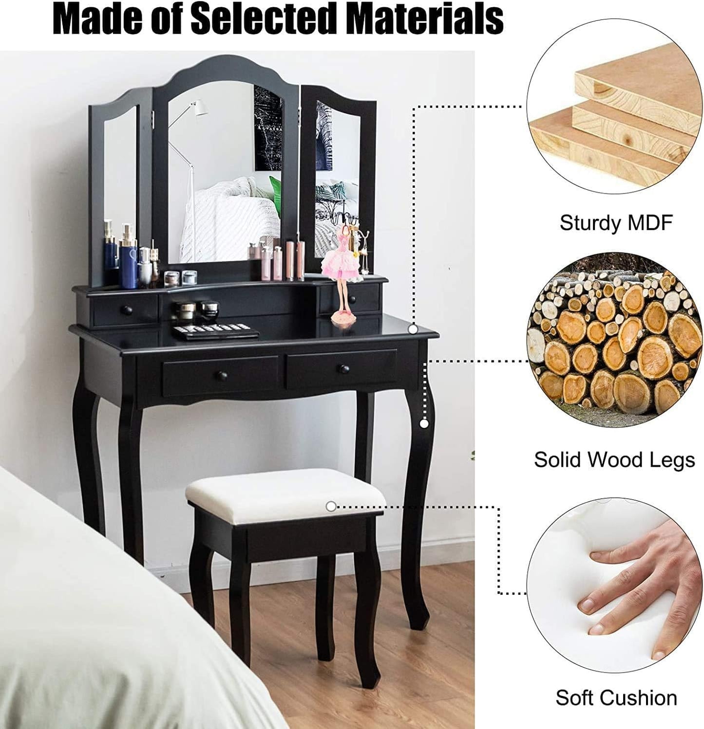 Black vanity table with mirror, stool, and cosmetic items on a wooden floor.