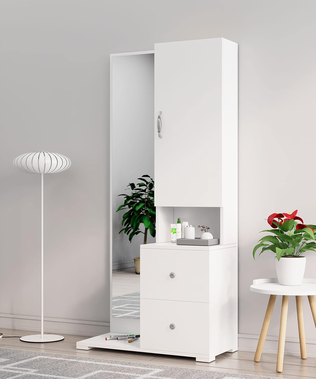 White cabinet with a mirror in a room with a lamp and plants