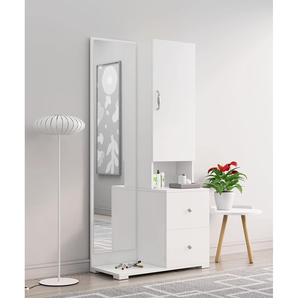 White dresser with full-length mirror in a room with a lamp and plant.