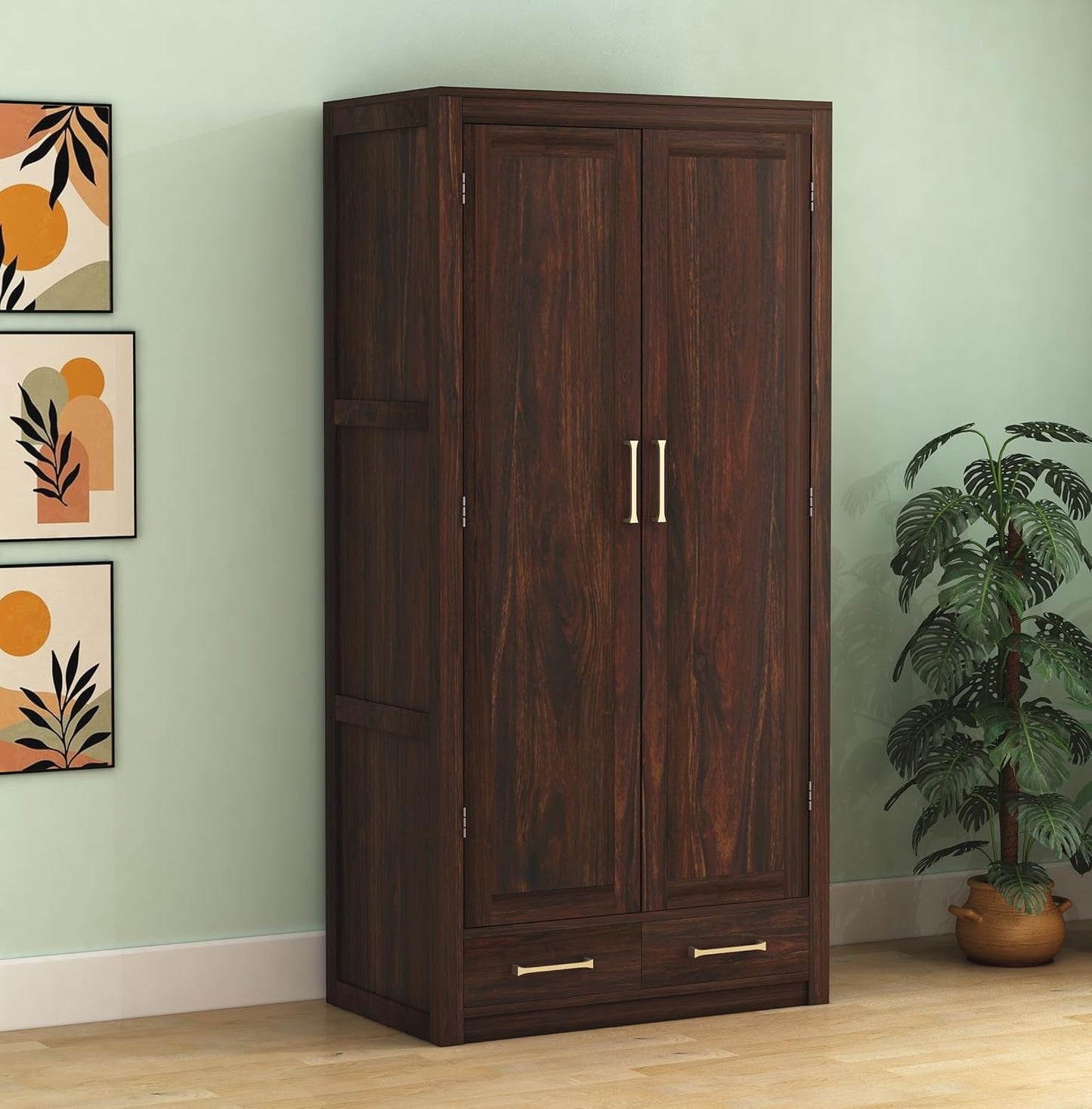 Wooden wardrobe with two doors and a drawer against a light green wall with decorative elements.