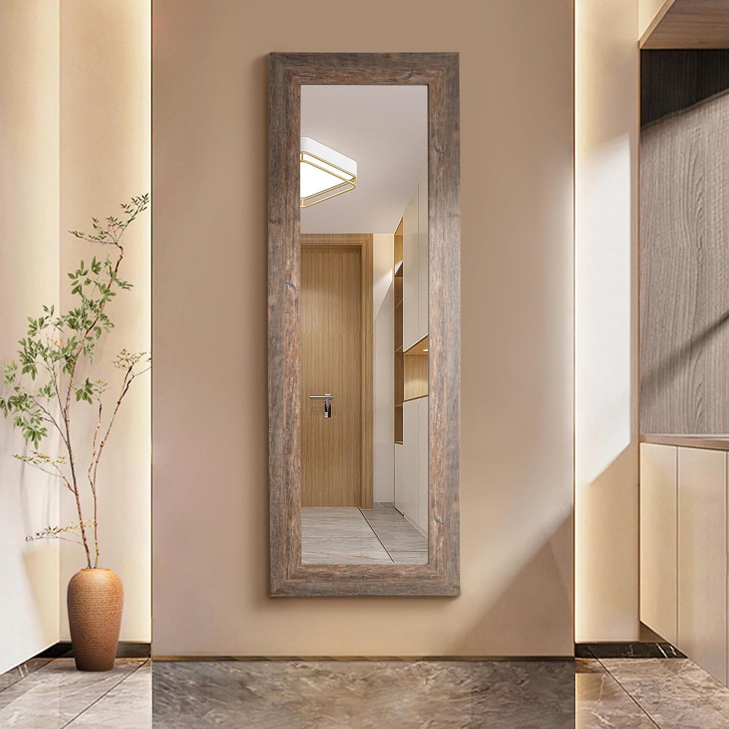 Wooden-framed mirror on a wall in a modern interior setting
