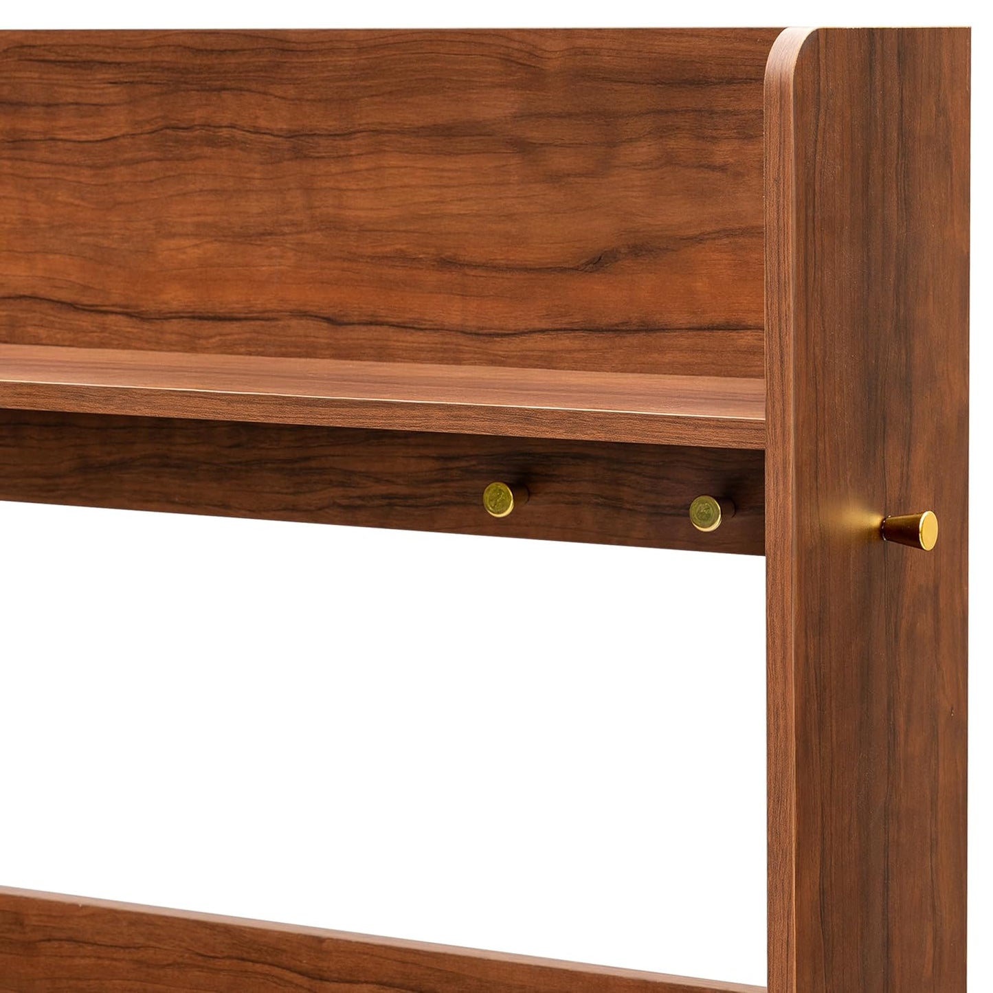 Wooden headboard with gold knobs on a white background