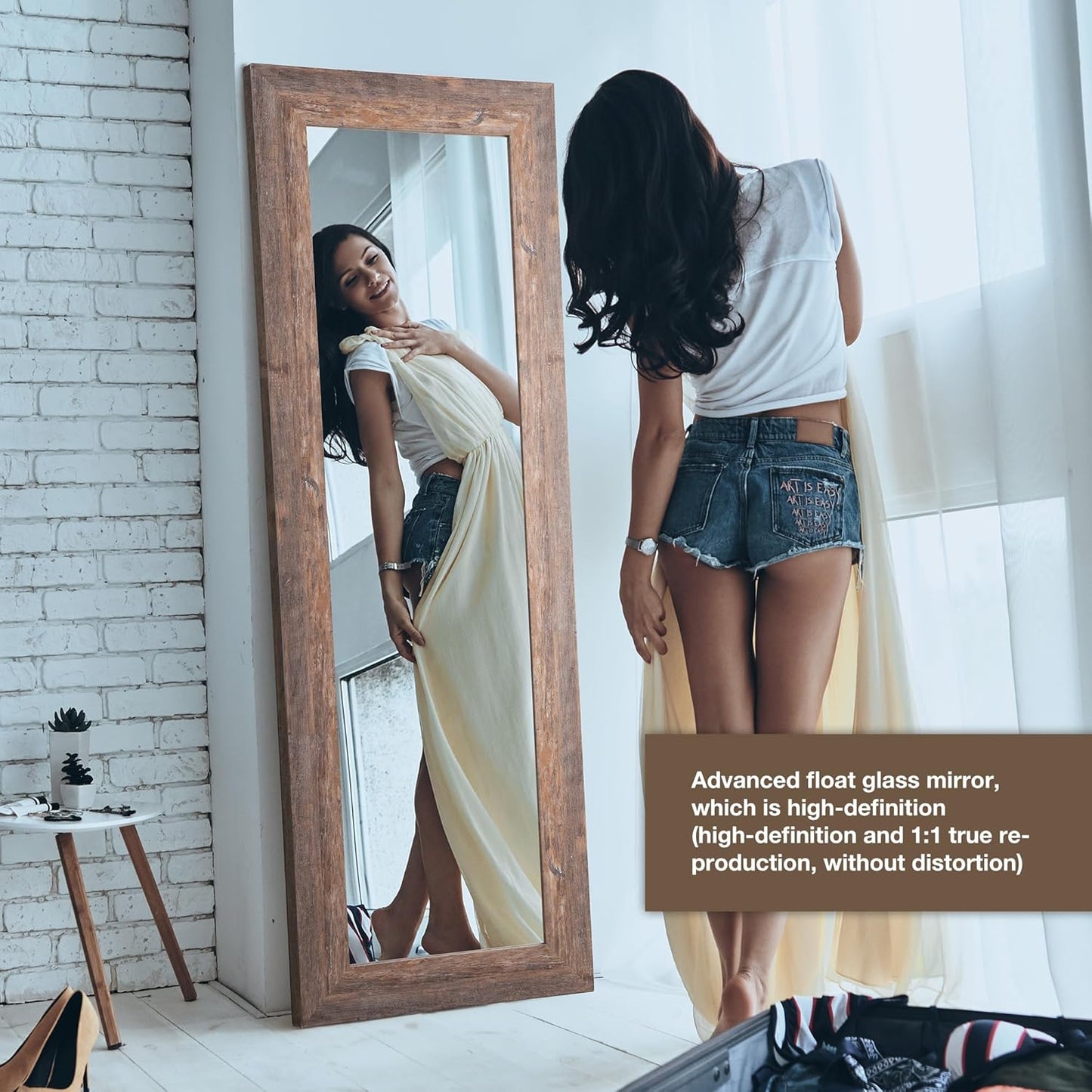 Woman looking at herself in a tall wooden-framed mirror with text about the mirror's features.