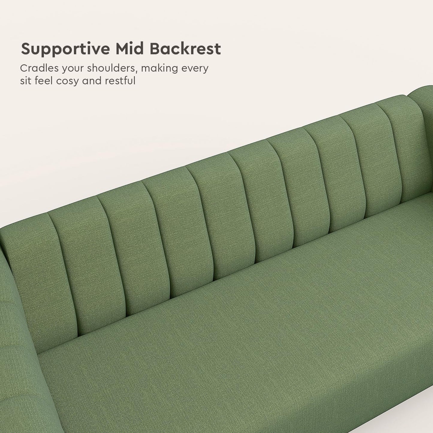 Green sofa with supportive mid backrest on a white background
