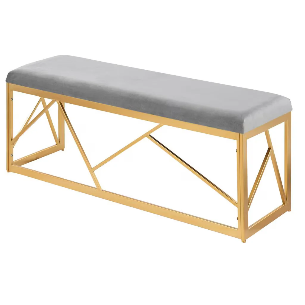 Bench with gold frame and gray cushion on a white background