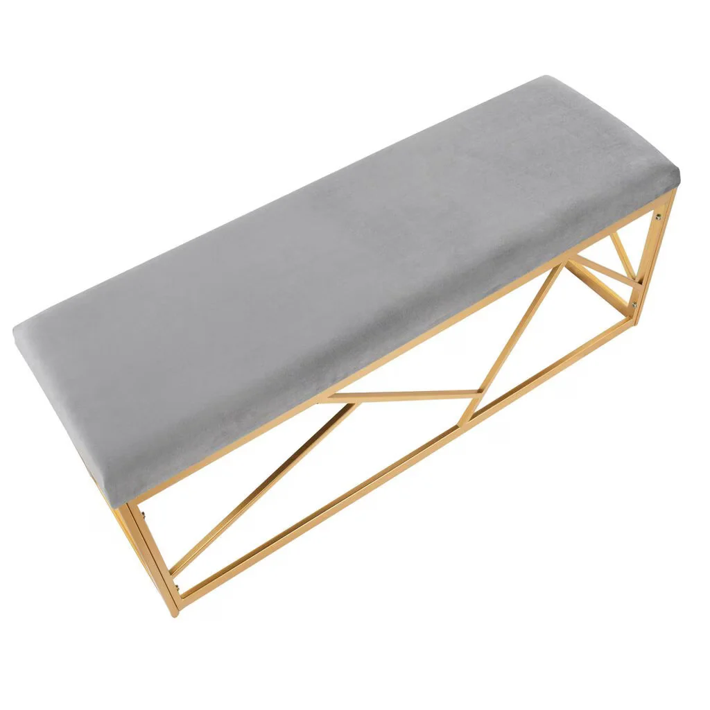 Gray cushioned bench with gold metal frame on a white background