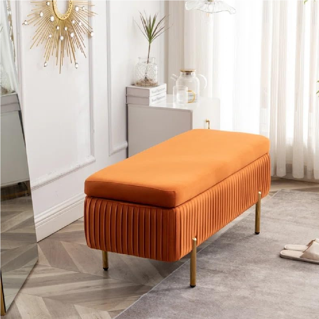 Orange upholstered bench in a room with decorative elements.
