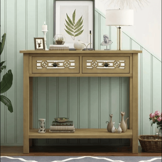 Wooden console table with decorative items against a green paneled wall.