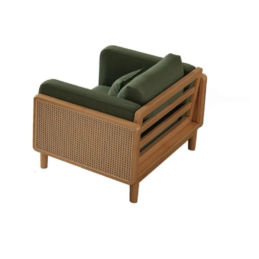 Wooden armchair with wicker backrest and green cushions on a white background