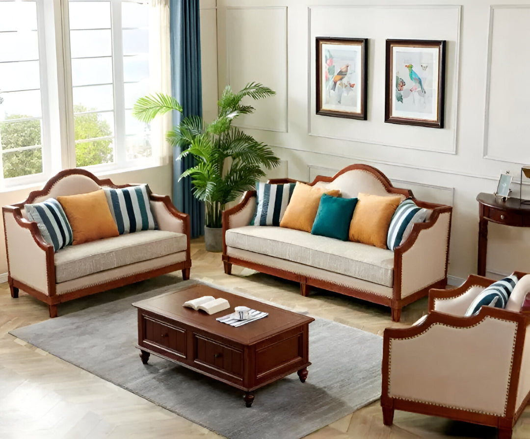 Living room with wooden furniture, beige sofas, and decorative pillows.