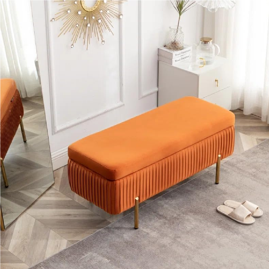 Orange bench in a room with a mirror and decorative items.