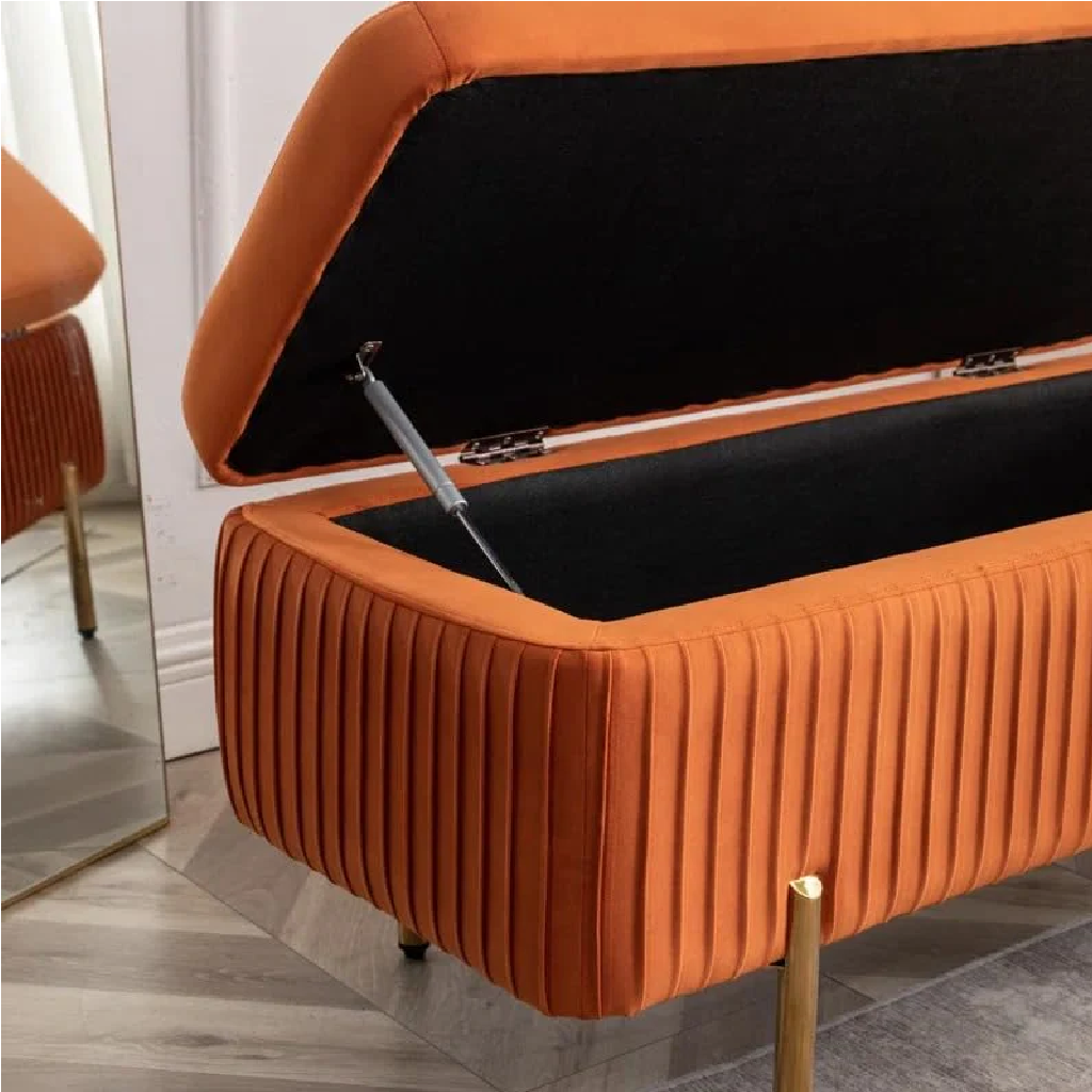 Orange storage bench with a black interior, open to reveal a black cushion.