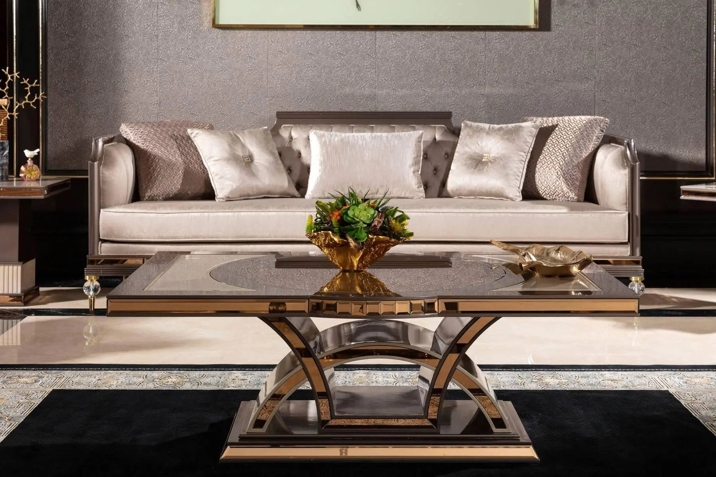 Modern living room with a gray sofa, glass coffee table, and decorative elements.