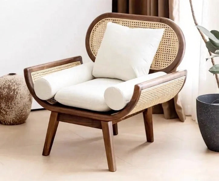 Wicker chair with white cushions in a minimalistic room setting