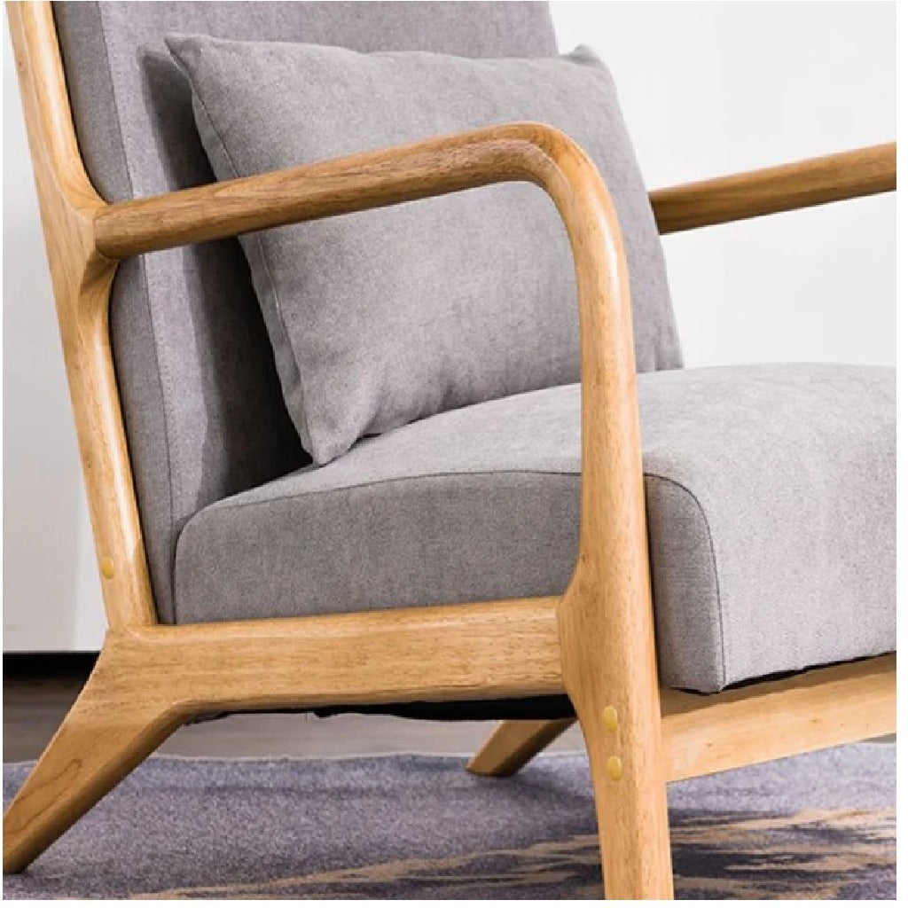 Gray cushioned chair with wooden frame on a light background