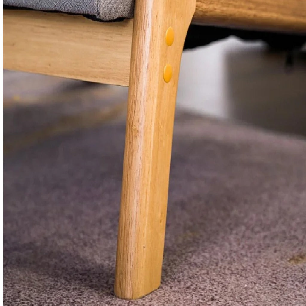 Close-up of a wooden chair leg with a blurred background