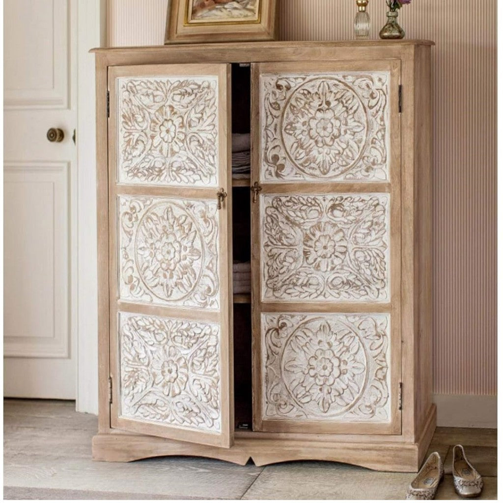 Wooden cabinet with decorative carvings in a room setting
