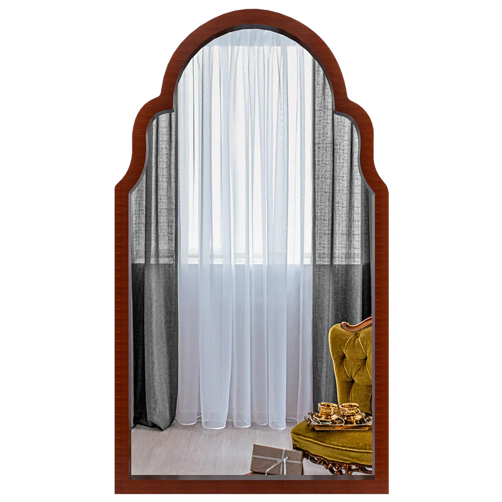 Wooden-framed mirror reflecting a room with curtains and a yellow chair.