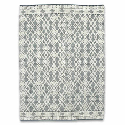 Patterned rug with geometric design on a white background