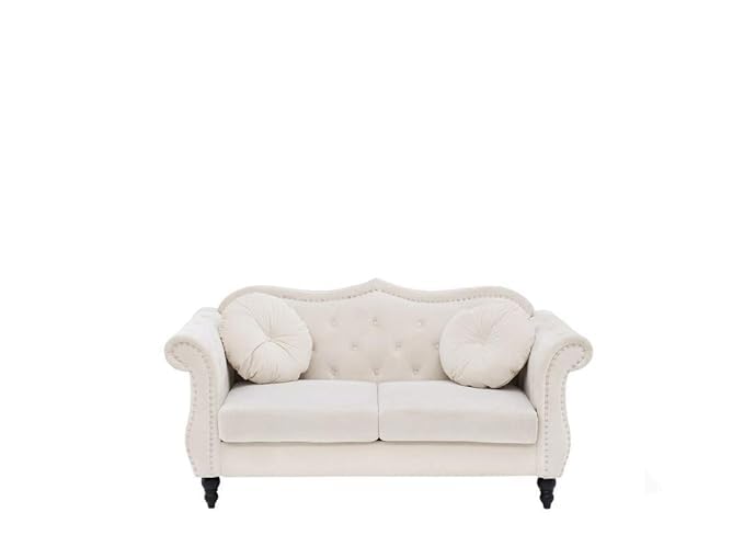 White sofa with decorative cushions on a white background