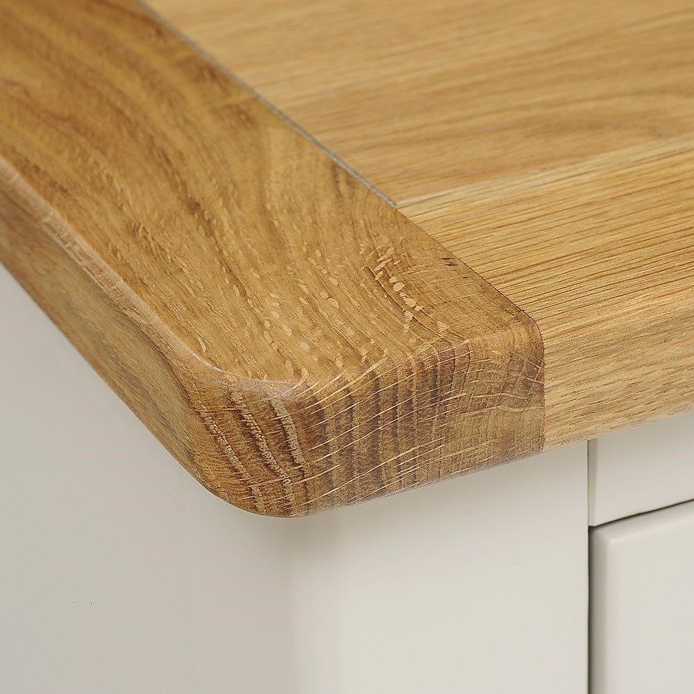 Close-up of a wooden cutting board on a white surface