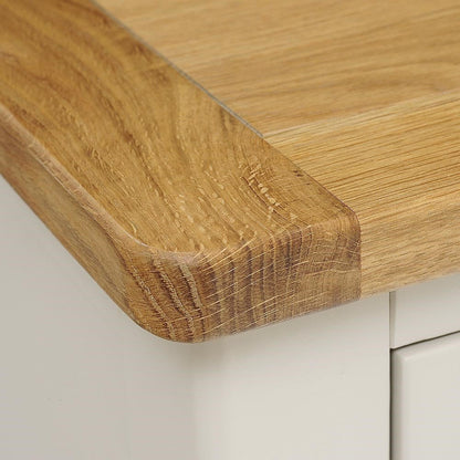 Close-up of a wooden cutting board on a white surface