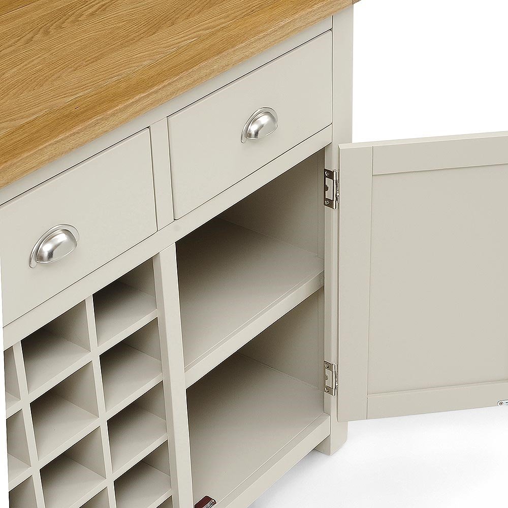 Light gray kitchen cabinet with wooden top and silver handles on a white background