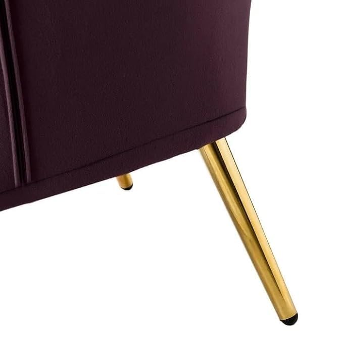 Close-up of a purple chair with gold legs on a white background