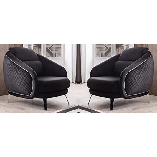 Two black armchairs with quilted design in a room setting.
