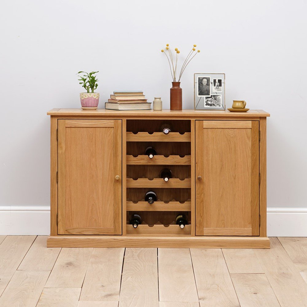 Wooden sideboard with wine storage on a light wooden floor.