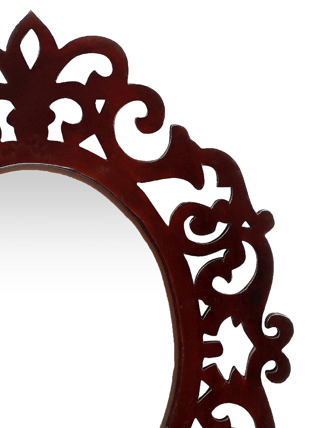 Decorative mirror with intricate brown frame on a white background