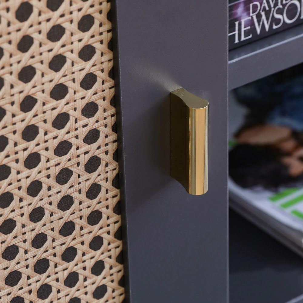 Close-up of a gold handle on a gray cabinet with wicker basket and magazine in the background