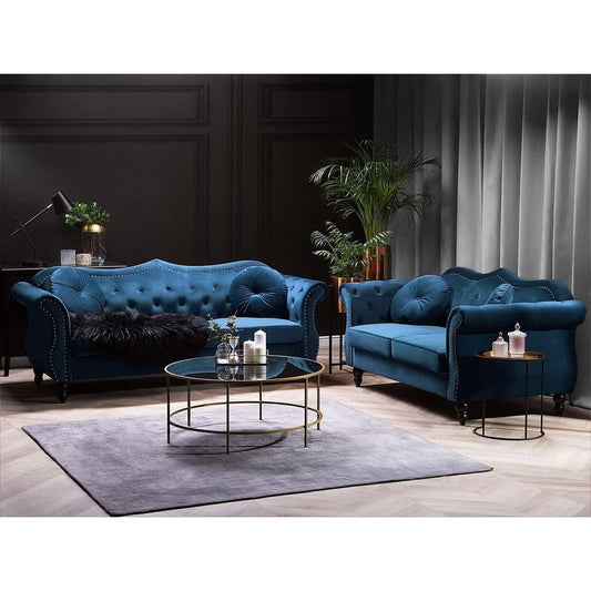 Two blue sofas in a living room setting with a coffee table and decorative items.