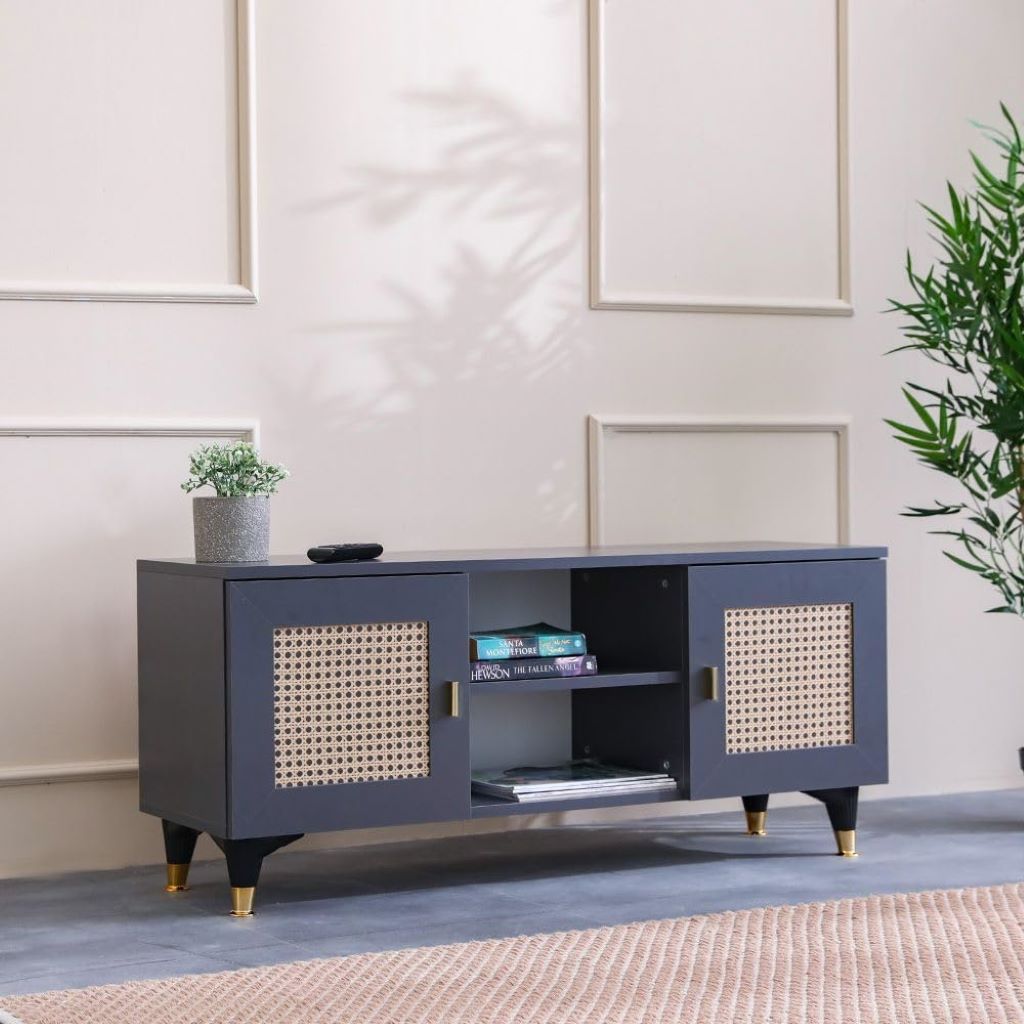 Navy blue TV stand with wicker doors in a living room setting.
