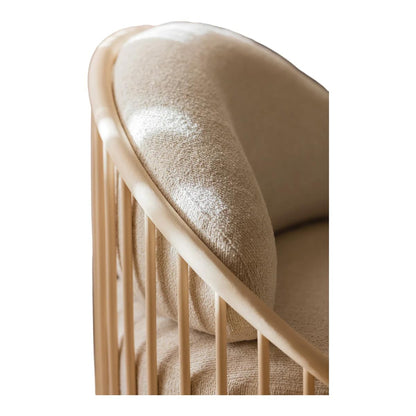Close-up of a textured beige cushion on a wooden chair with a white background