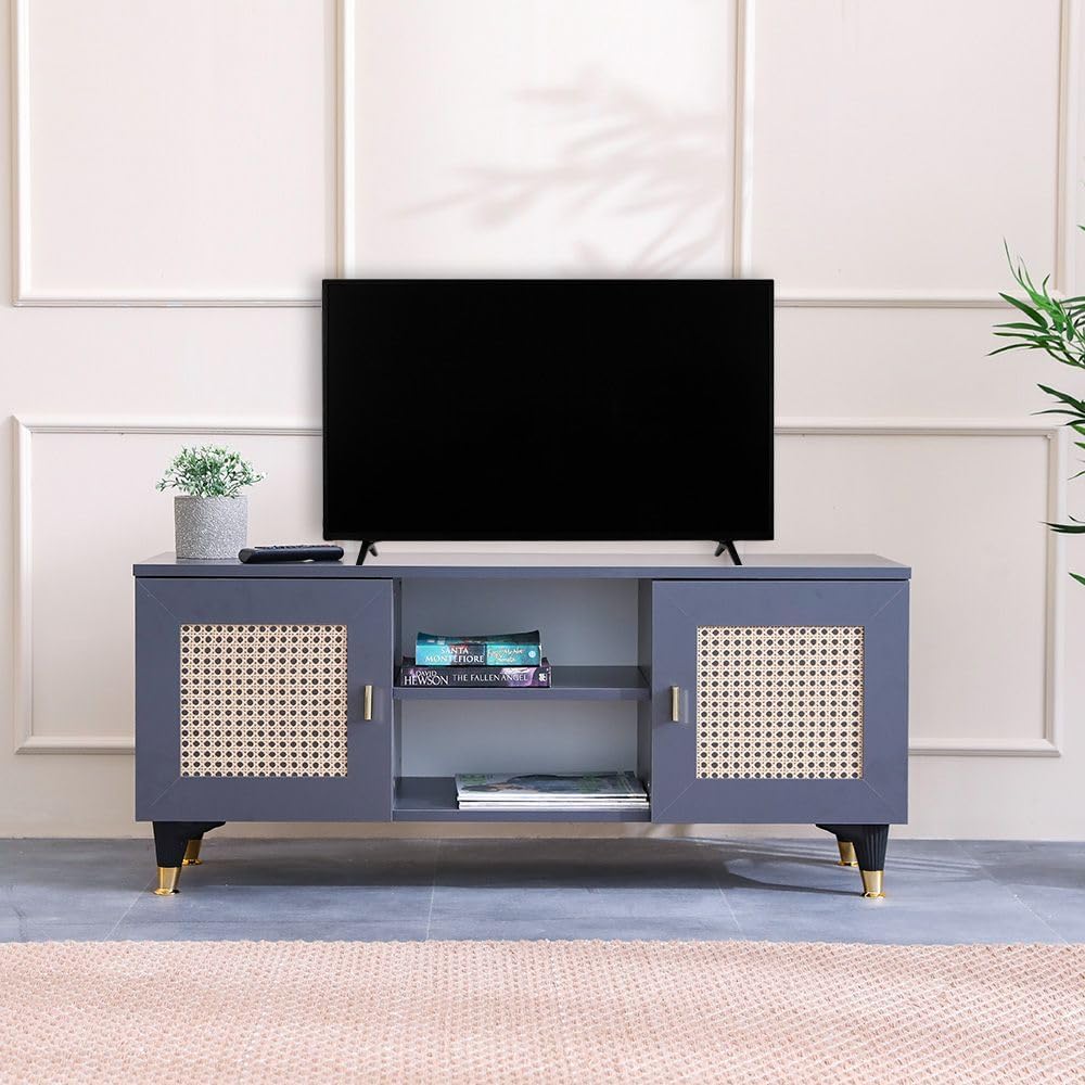 Blue TV stand with a television on top against a light-colored wall.