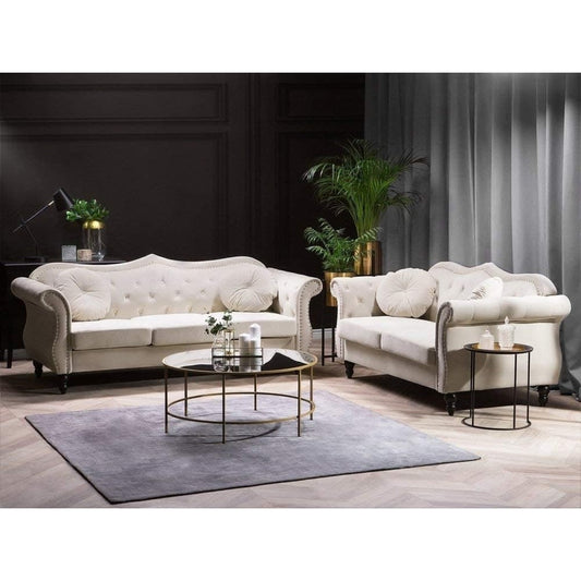 White sofa set in a living room with decorative elements.