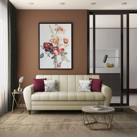 Modern living room with beige sofa, decorative pillows, and a floral painting on the wall.